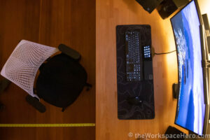top view of desk setup with measuring tape measuring chair space